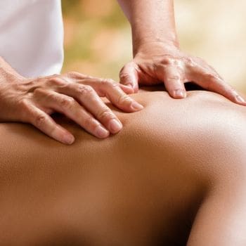The back of a person receiving a massage.